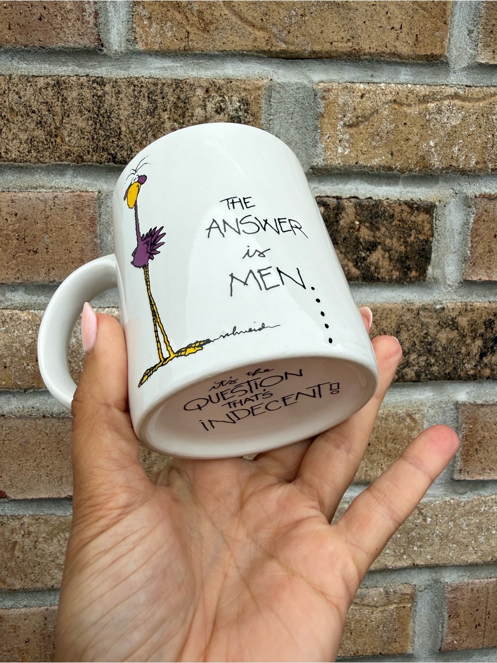 White Ceramic Mug with Humorous Script and Cartoon Bird